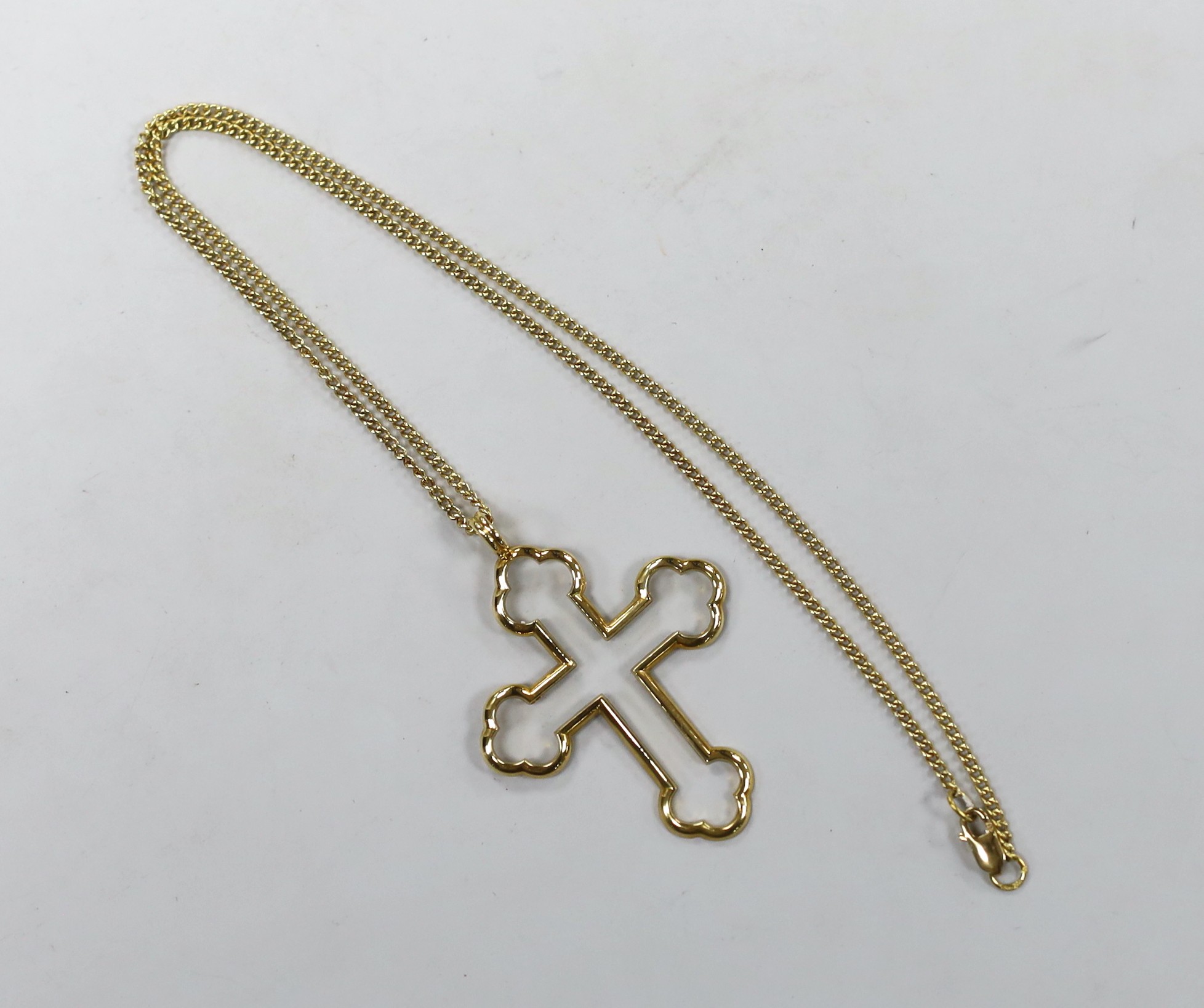 A modern 18ct gold Advalorem(for the V&A Museum in London) cross pendant, influenced by the designs of Pugin,46mm, on an 18ct gold chain, 39cm, 8.4 grams.
